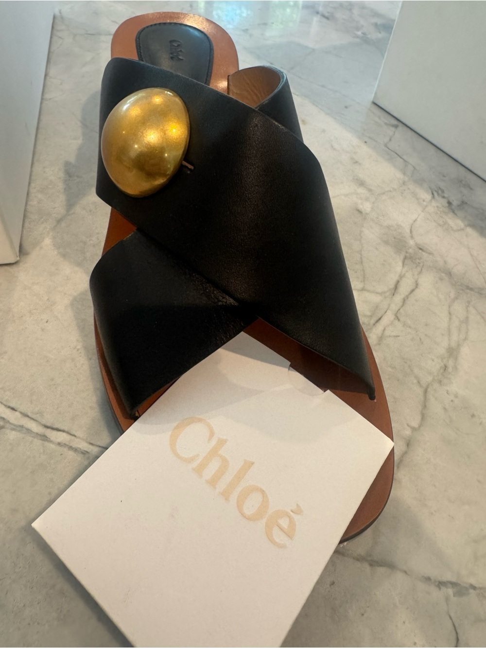 Chloé Black Leather Crisscross Slide with Gold Disc Accent